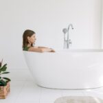 photo of woman on bathtub